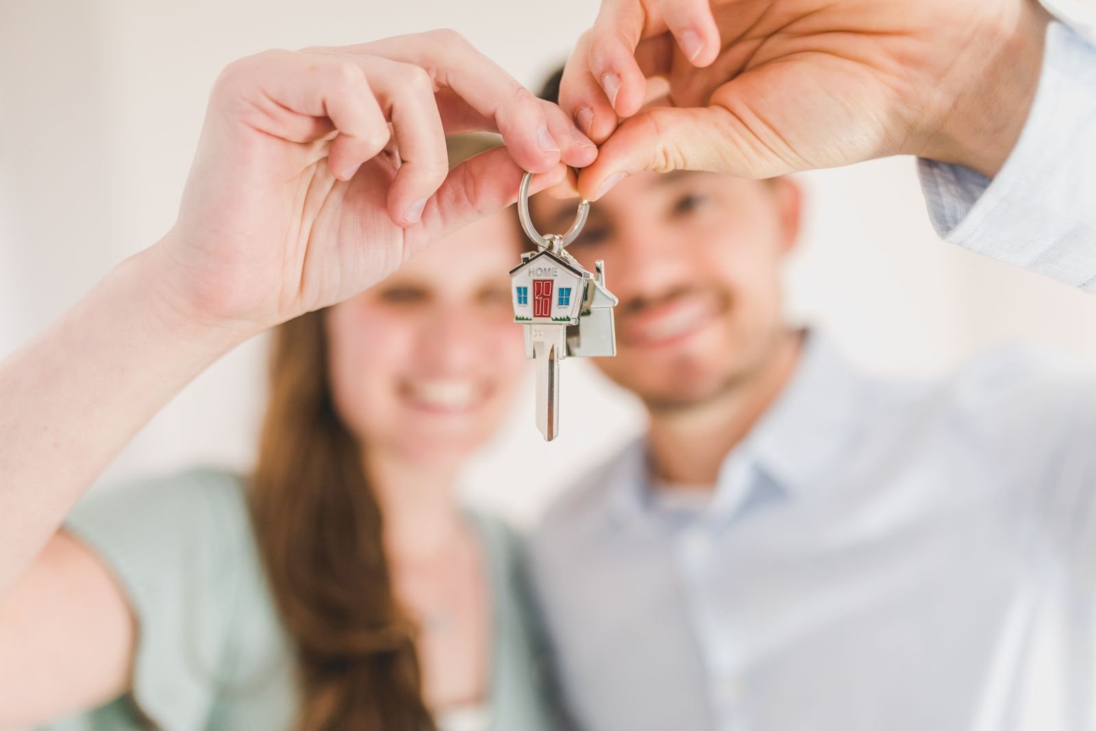 Happy couple with the keys to their new home